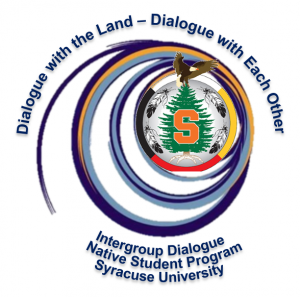 Dialogue logo depicting the name as noted, blue swirl, an evergreen with an eagle on top, and a large orange S in the middle